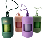 Set of Golden Life dog poop bag holders in Evergreen, Cotton Candy Pink, Lavender, and Pistachio colors, each with clip and waste bags included.