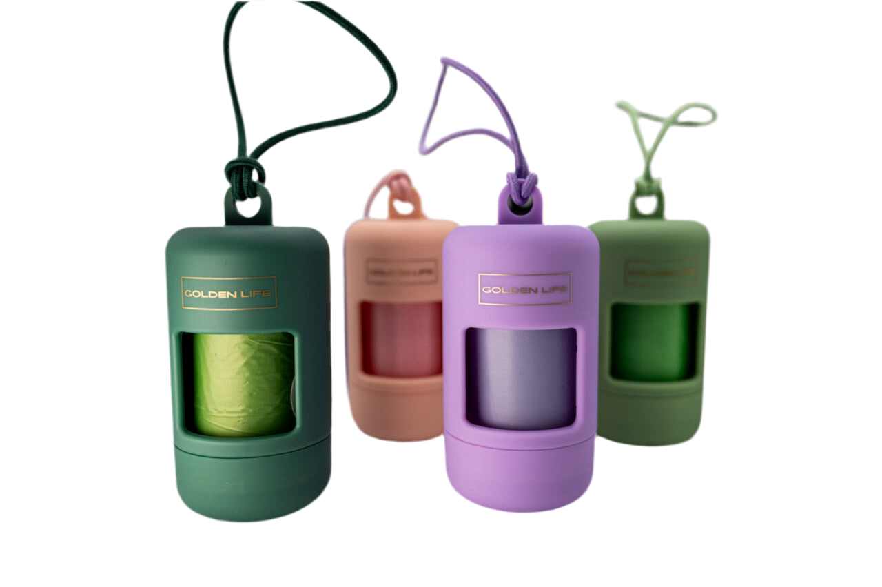 Set of Golden Life dog poop bag holders in Evergreen, Cotton Candy Pink, Lavender, and Pistachio colors, each with clip and waste bags included.