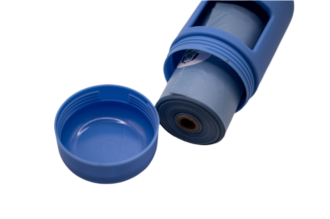 Close-up of Moonlight Blue dog poop bag dispenser with twist-off cap open, showing roll of waste bags inside.