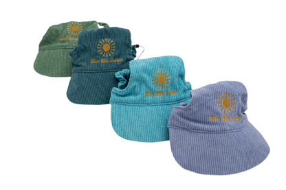 Corduroy dog hats with bills from the Live Life Golden collection in green, blue, teal, and purple, featuring sunburst embroidery.