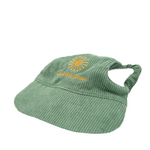 Angled view of Moss & Mischief green corduroy dog hat with golden sunburst embroidery and ‘Live Life Golden’ text.