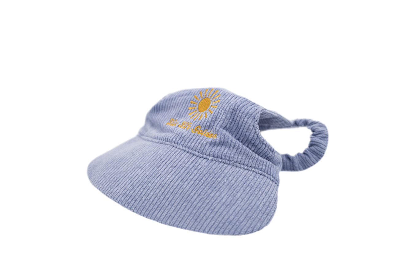 Side view of light purple corduroy dog hat with yellow embroidered sunburst and “Live Life Golden” text, featuring ear openings and curved brim — The Golden Life Lilac Daydream.