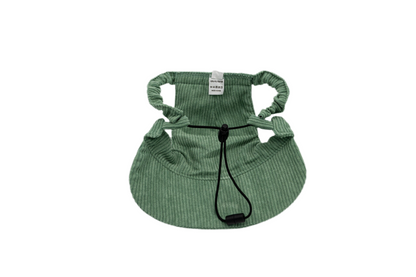 Back view of Moss & Mischief green corduroy dog hat showing adjustable chin strap and ear holes for secure fit.
