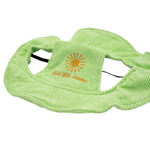 Light green corduroy dog hat with embroidered yellow sunburst and “Live Life Golden” text, featuring ear holes and adjustable strap — The Golden Life Key Lime Fisherman collection.