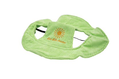 Light green corduroy dog hat with embroidered yellow sunburst and “Live Life Golden” text, featuring ear holes and adjustable strap — The Golden Life Key Lime Fisherman collection.