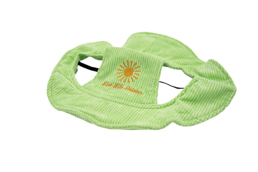 Light green corduroy dog hat with embroidered yellow sunburst and “Live Life Golden” text, featuring ear holes and adjustable strap — The Golden Life Key Lime Fisherman collection.