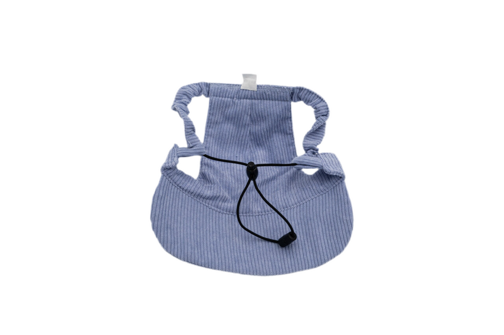 Back view of light purple corduroy dog hat showing adjustable chin strap, ear openings, and soft curved brim — The Golden Life Lilac Daydream.