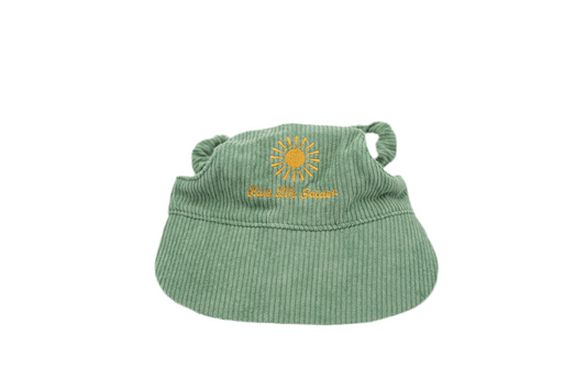 Moss & Mischief green corduroy dog hat with sunburst embroidery and ‘Live Life Golden’ text.