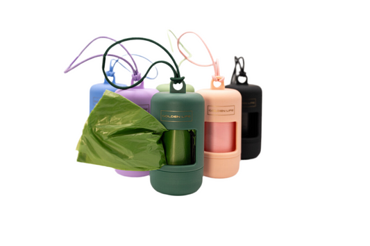 Dog poop bag holders in green, pink, blue, purple, and black with clip-on design for easy cleanup on walks.