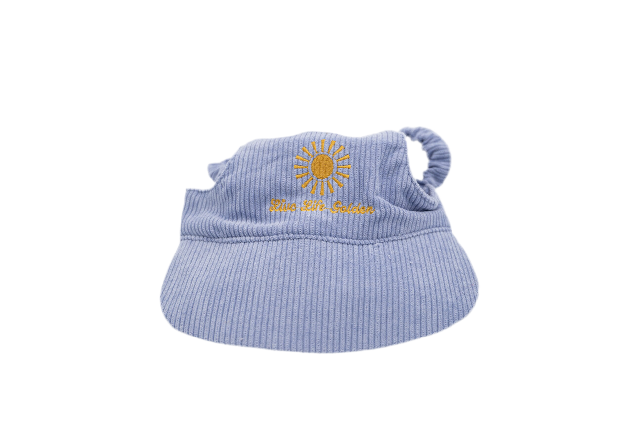 Light purple corduroy dog hat with yellow embroidered sunburst and “Live Life Golden” text, featuring ear openings and a soft curved brim — The Golden Life Lilac Daydream.