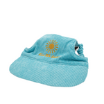 Side view of neon blue corduroy dog hat with golden sunburst and ‘Live Life Golden’ embroidery.