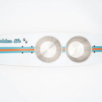 The Golden Life Kickflip Kibble Board dog feeder shaped like a skateboard with two stainless steel bowls, white board design with teal and orange racing stripes, and fixed black wheels. Get your Skateboard Dog Bowl today!