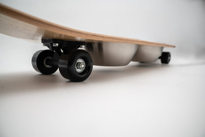 The Golden Life Kickflip Kibble Board dog feeder shaped like a skateboard with two stainless steel bowls, white board design with teal and orange racing stripes, and fixed black wheels. Get your Skateboard Dog Bowl today!