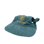 Side view of blue corduroy dog hat with golden sunburst and ‘Live Life Golden’ embroidery from The Golden Life.