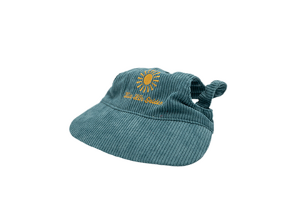 Side view of blue corduroy dog hat with golden sunburst and ‘Live Life Golden’ embroidery from The Golden Life.