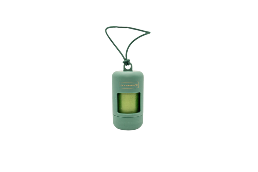Evergreen green dog poop bag holder dispenser with clip, includes one roll of bags for easy leash attachment.