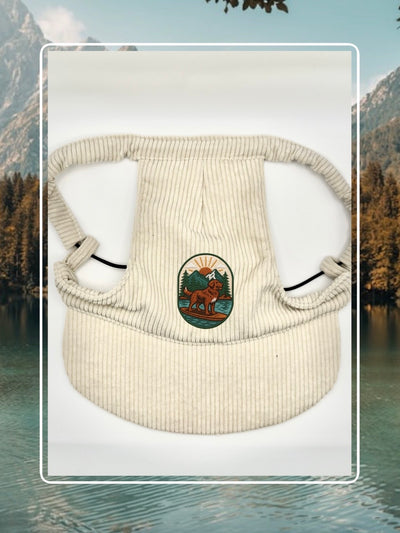 Cream corduroy dog hat with the Kodiak adventure paddleboard iron on patch.