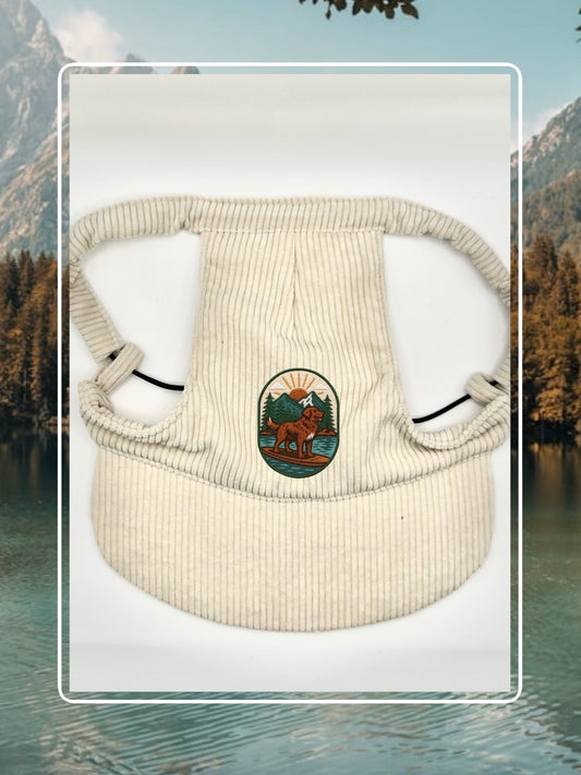 Cream corduroy dog hat with the Kodiak adventure paddleboard iron on patch.
