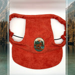Red corduroy dog hat with the Kodiak adventure paddleboard iron on patch.