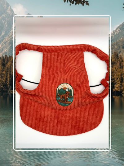 Red corduroy dog hat with the Kodiak adventure paddleboard iron on patch.