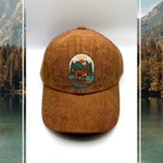 Brown corduroy human hat with the Kodiak paddleboard adventure iron on patch inspired by outdoor living.