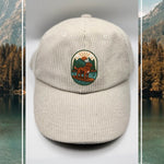 Cream corduroy human hat with the Kodiak paddleboard adventure iron-on. patch inspired by outdoor living.