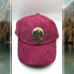 Purple corduroy human hat with the Kodiak paddleboard adventure iron on patch inspired by outdoor living.