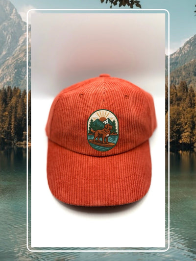 Red corduroy human hat with the Kodiak paddleboard adventure iron on patch inspired by outdoor living.