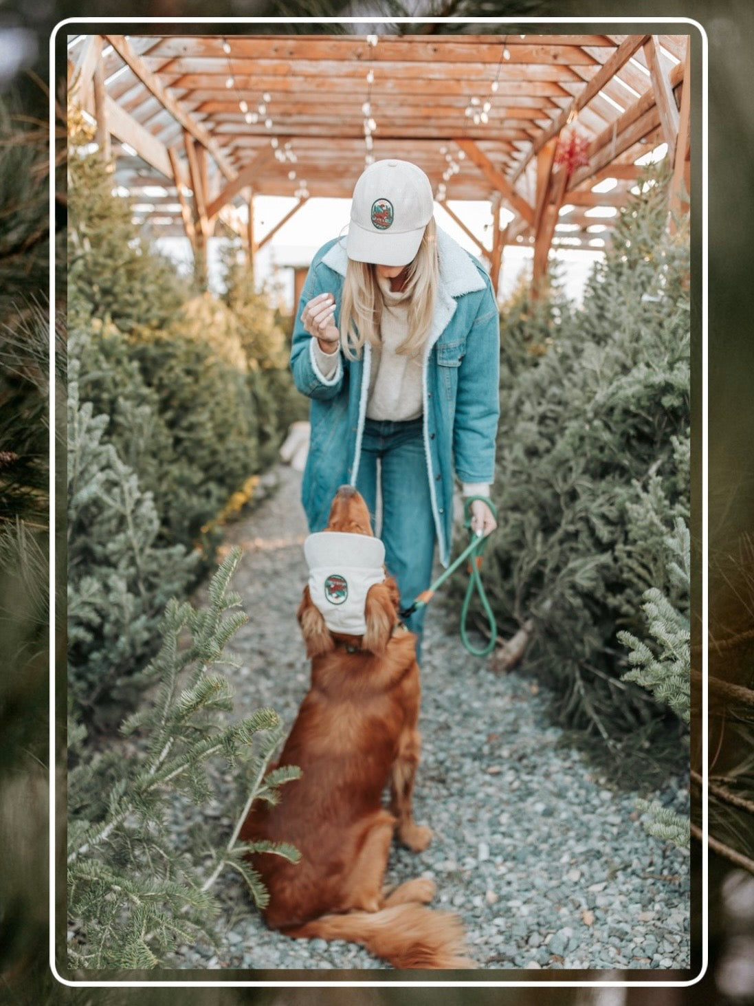 Woman and golden retriever wearing matching Cream Colored Kodiak adventure corduroy hats while training outdoors among evergreen trees.