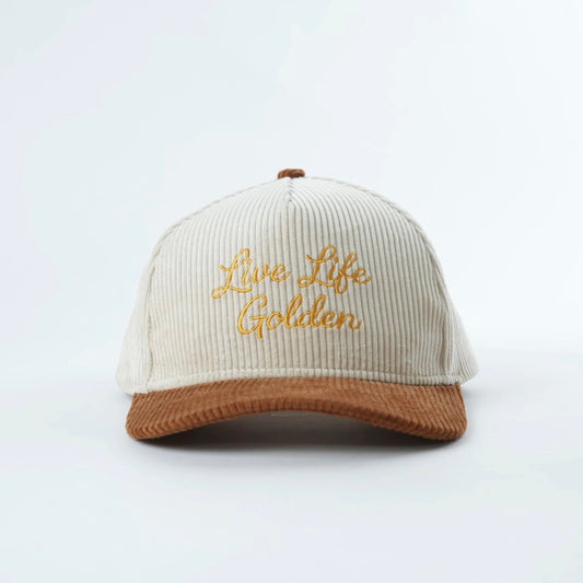 Embroidered corduroy snapback hat in cream and brown with “Live Life Golden” stitching on the front