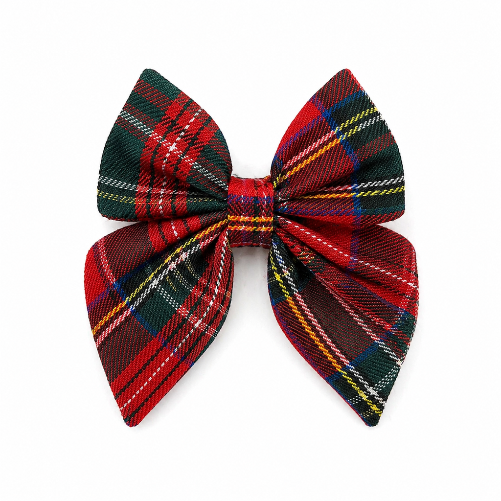 Red and green plaid dog bow on a white background