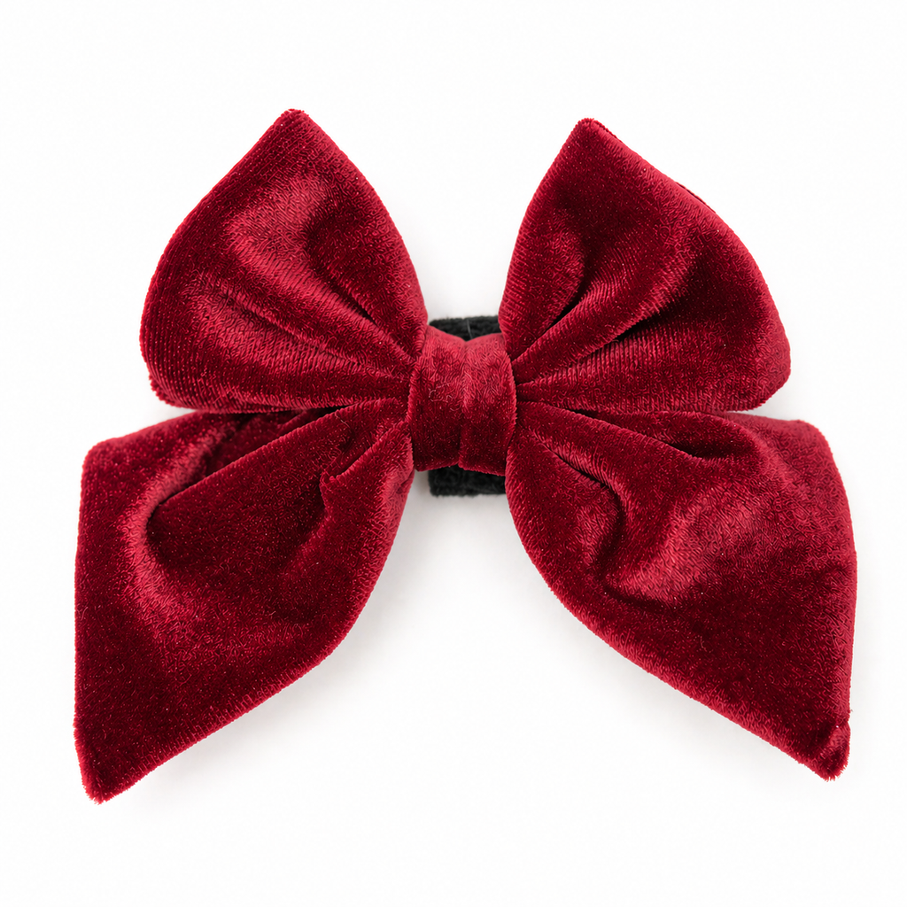 Red velvet dog bow in cranberry crush color on a white background